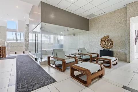 a bathroom with a tub and shower