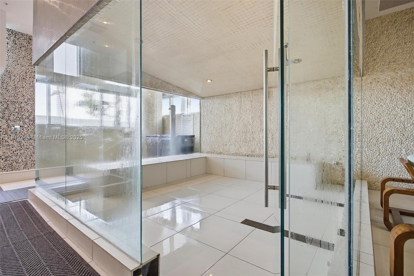 92 Southwest 3rd Street, Unit 1604 Miami, FL 33130 - Photo 38 of 53 a bathroom with a tub and shower