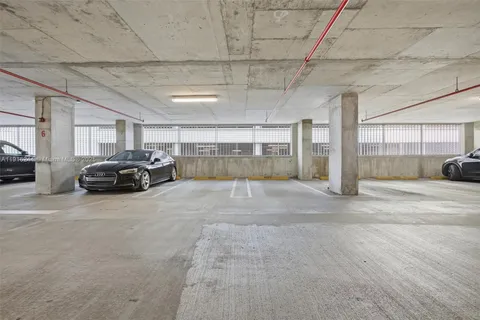 a view of a livingroom with furniture and a book shelf