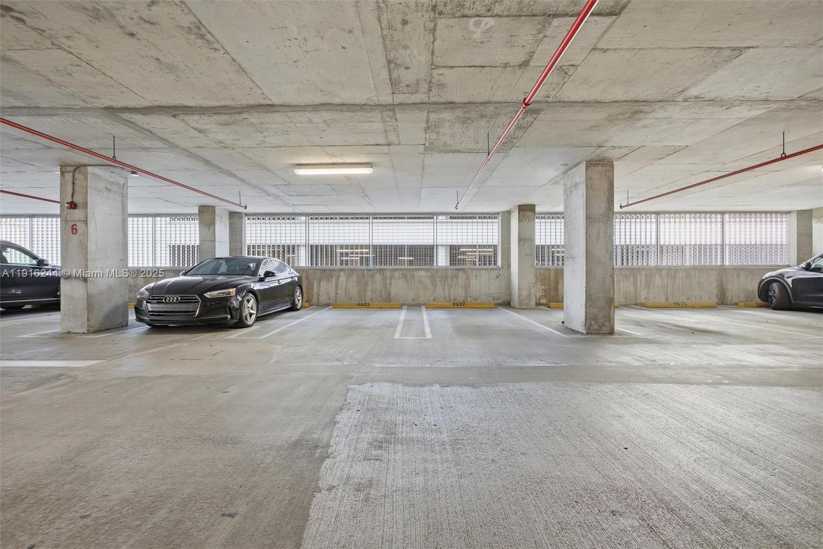 92 Southwest 3rd Street, Unit 1604 Miami, FL 33130 - Photo 41 of 53 a view of parking garage with car parked