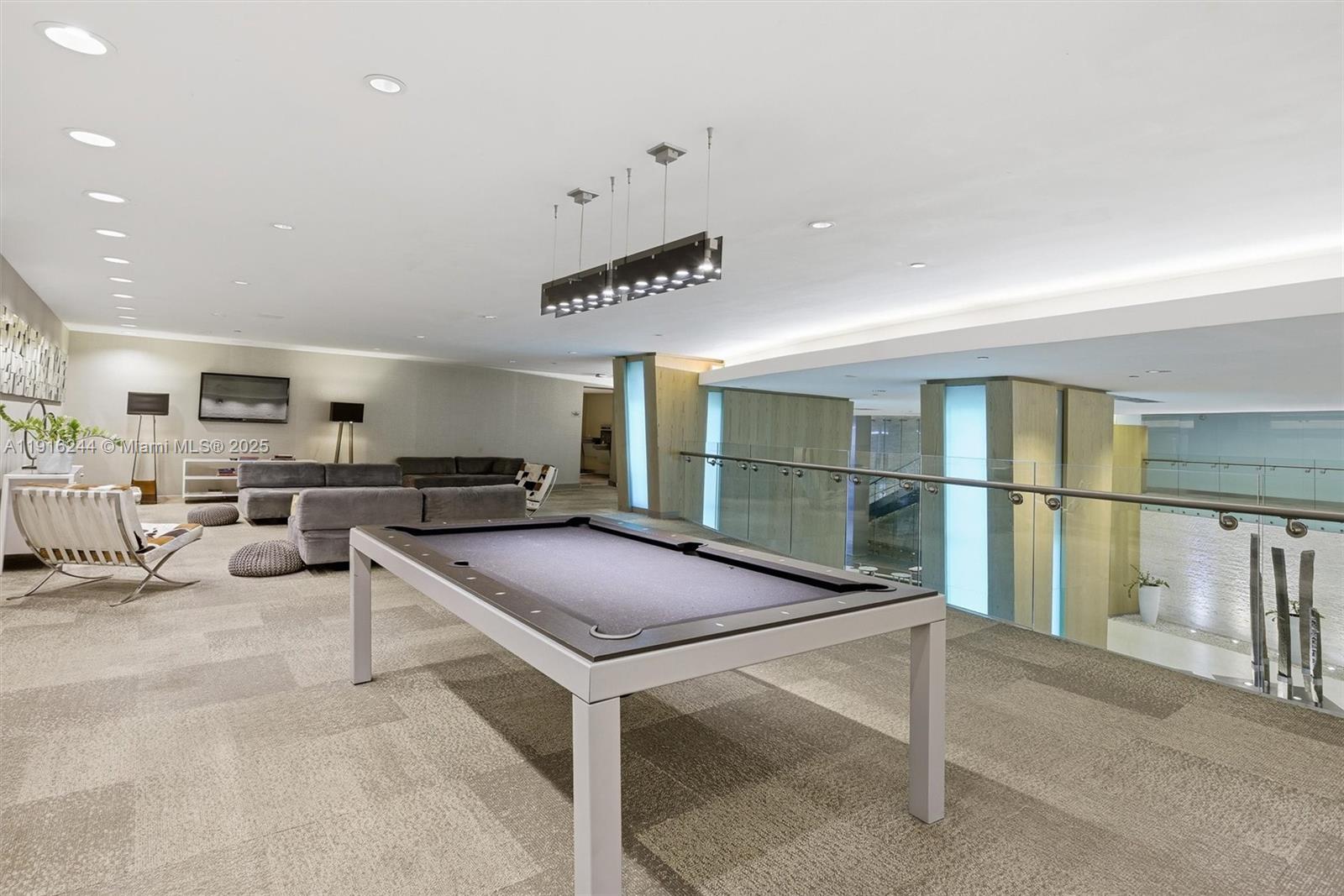 92 Southwest 3rd Street, Unit 1604 Miami, FL 33130 - Photo 43 of 53 a room with pool table and windows