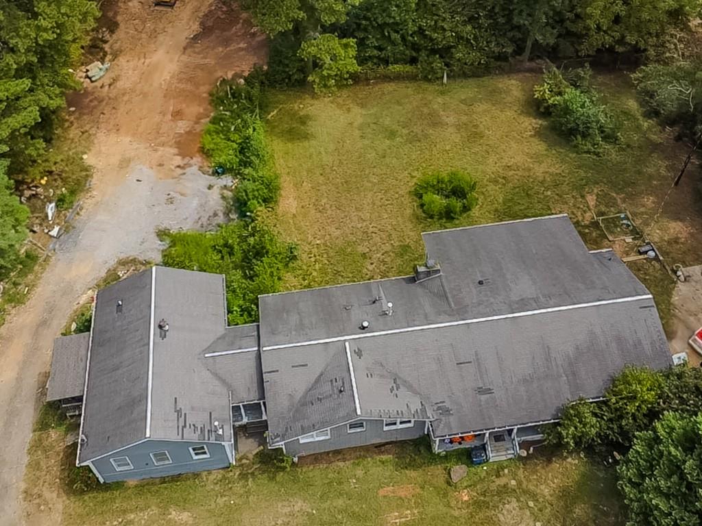 1142 Harbins Road Dacula, GA 30019 - Photo 5 of 18 an aerial view of residential houses with outdoor space