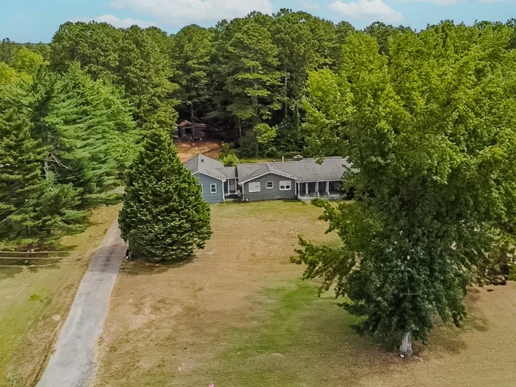 1142 Harbins Road Dacula, GA 30019 - Photo 10 of 18 a view of a lake with houses