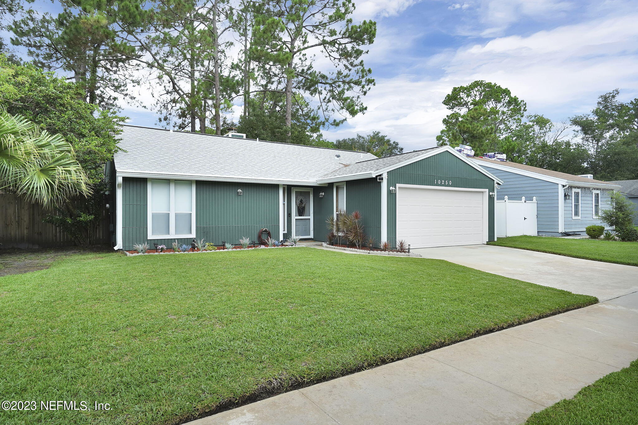 10250 Lake Pines Road Jacksonville, FL 32257 - Photo 2 of 24 a front view of a house with a garden