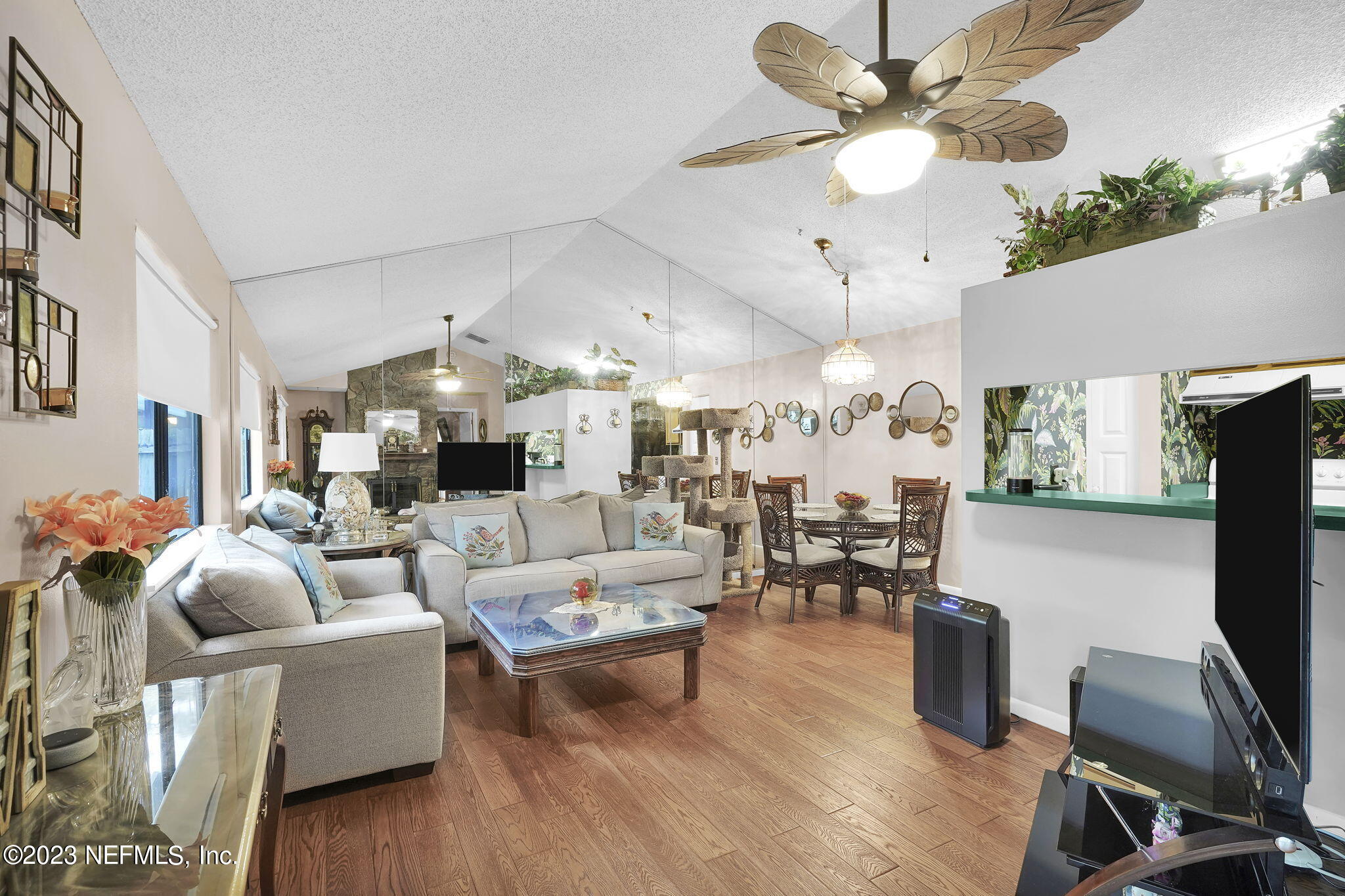 10250 Lake Pines Road Jacksonville, FL 32257 - Photo 7 of 24 a living room with furniture a fireplace and a chandelier