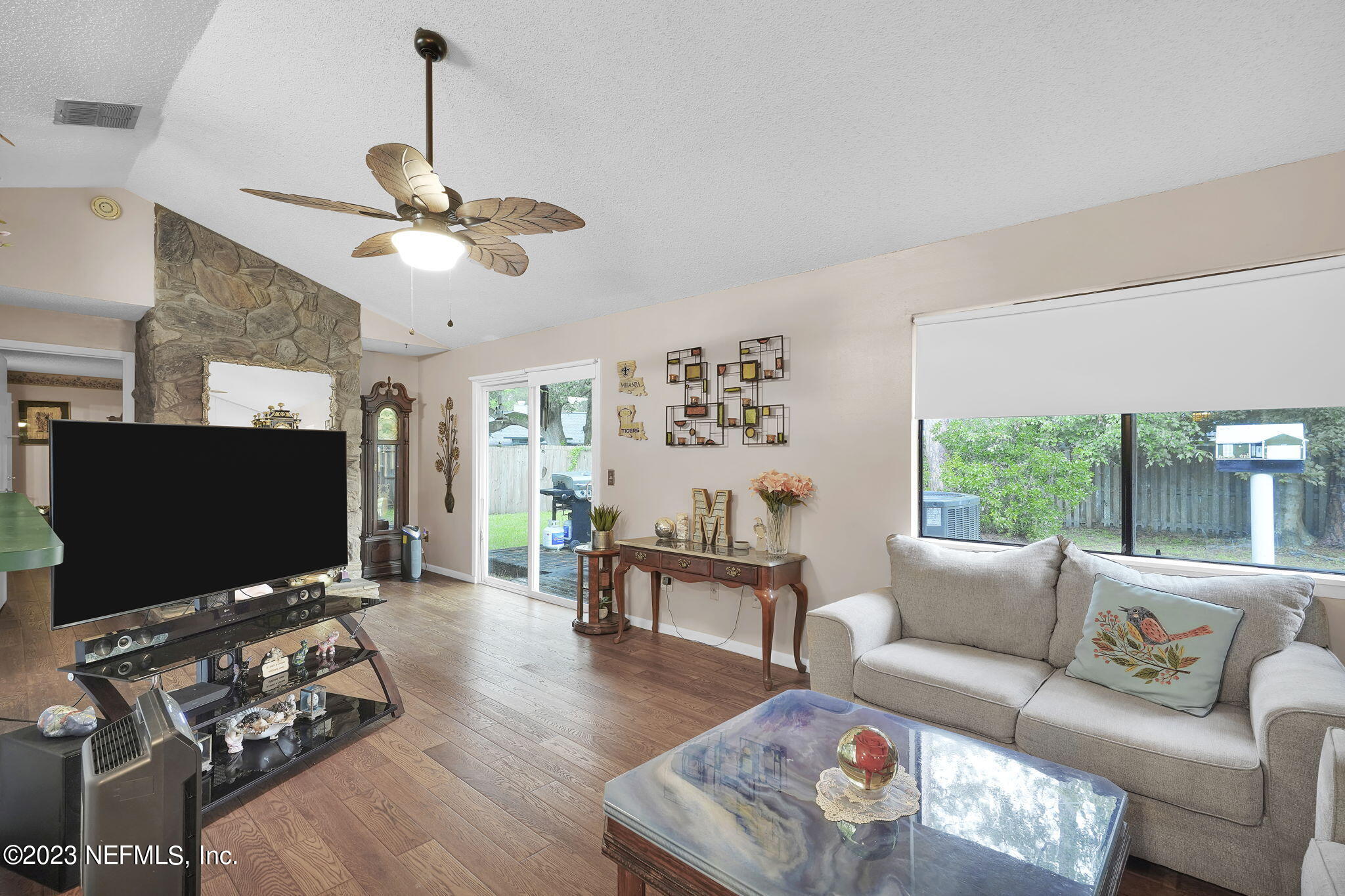 10250 Lake Pines Road Jacksonville, FL 32257 - Photo 9 of 24 a living room with furniture and a flat screen tv