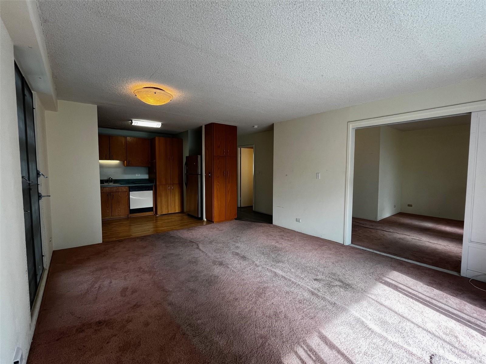 1615 Wilder Avenue, Unit 607 Honolulu, HI 96822 - Photo 6 of 19 a view of empty room with a fireplace