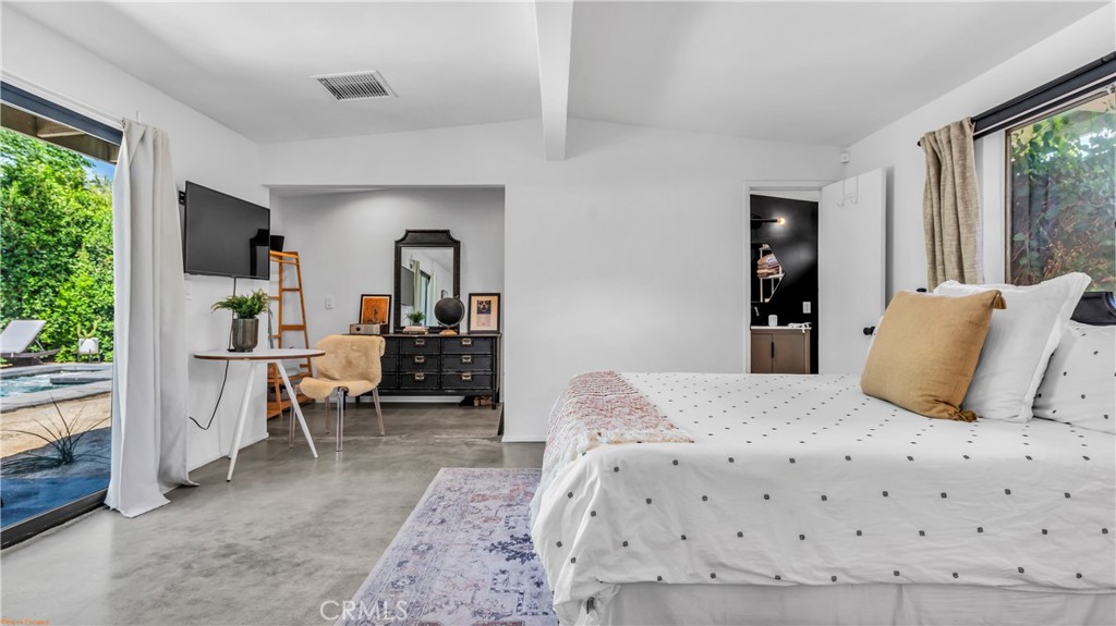 250 West Cortez Road Palm Springs, CA 92262 - Photo 27 of 54 a bedroom with a bed and a large window