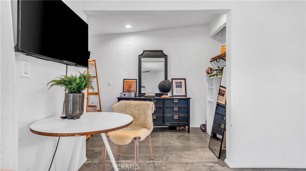 250 West Cortez Road Palm Springs, CA 92262 - Photo 29 of 54 a room with furniture and a flat screen tv