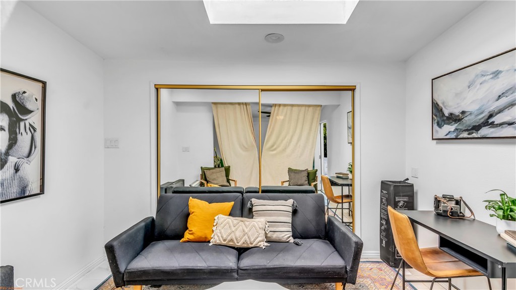 250 West Cortez Road Palm Springs, CA 92262 - Photo 36 of 54 a living room with furniture and a potted plant