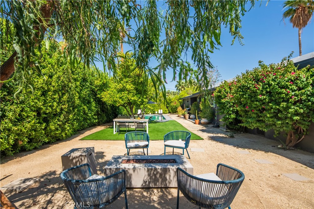 250 West Cortez Road Palm Springs, CA 92262 - Photo 43 of 54 a view of backyard with swimming pool and outdoor seating