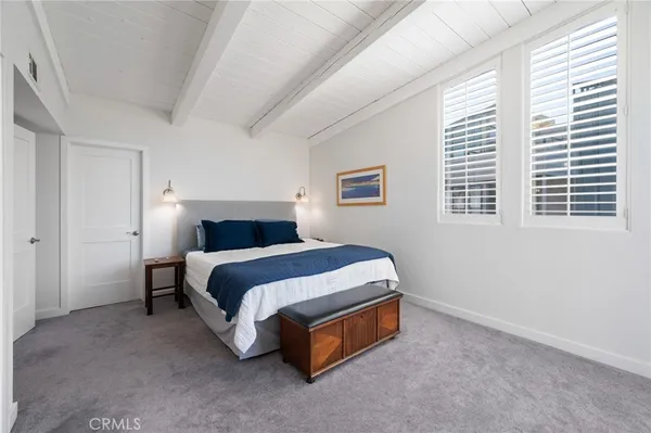 a bedroom with a bed and a cabinets