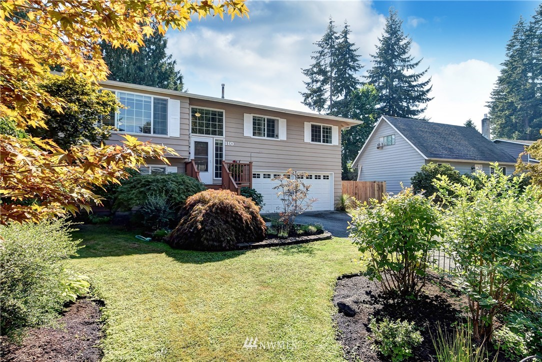 110 217th Place Southeast Bothell, WA 98021 - Photo 2 of 32 a view of a house with a garden