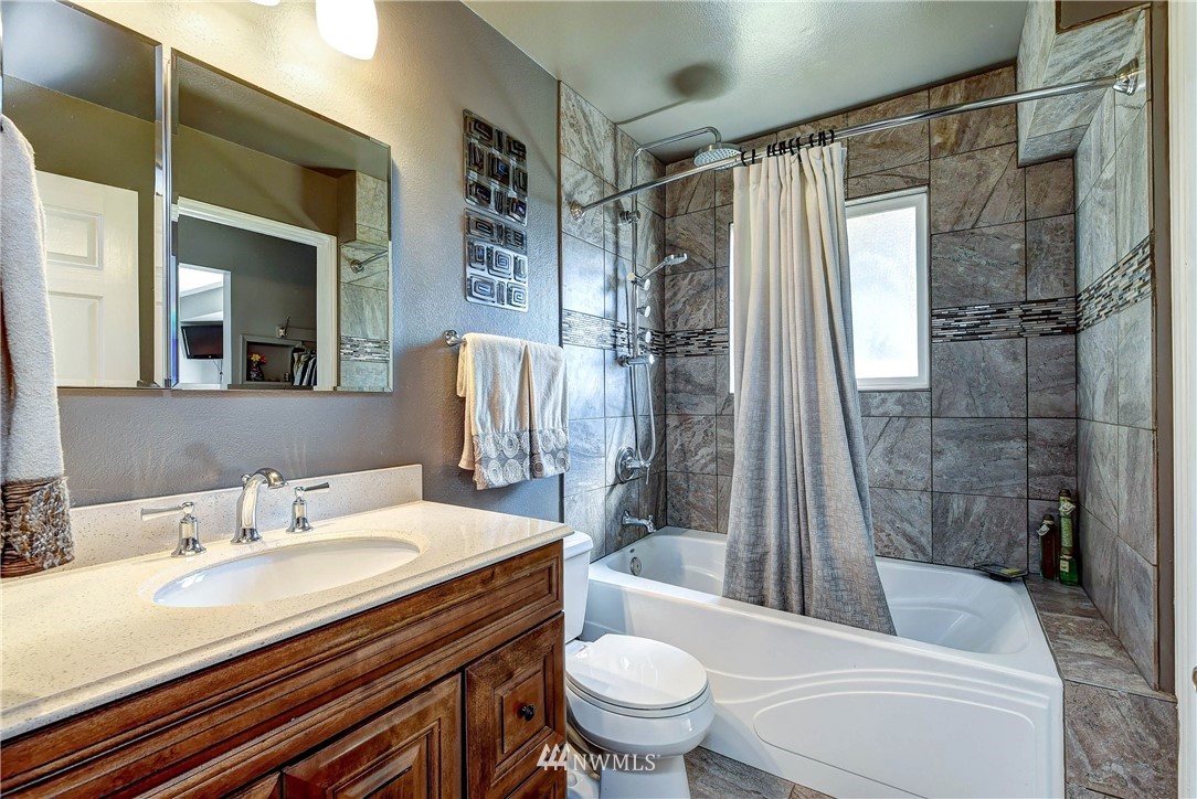 110 217th Place Southeast Bothell, WA 98021 - Photo 17 of 32 a bathroom with a sink toilet and shower
