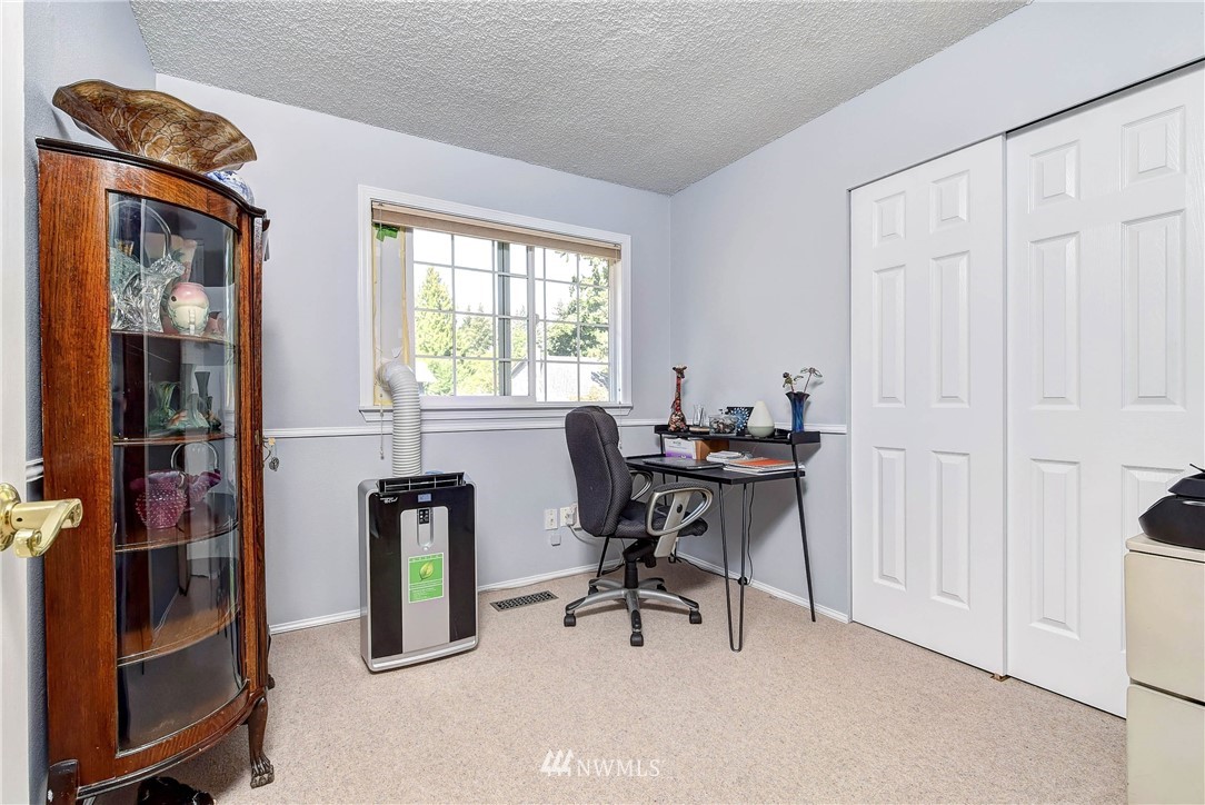 110 217th Place Southeast Bothell, WA 98021 - Photo 19 of 32 a workspace with furniture and window