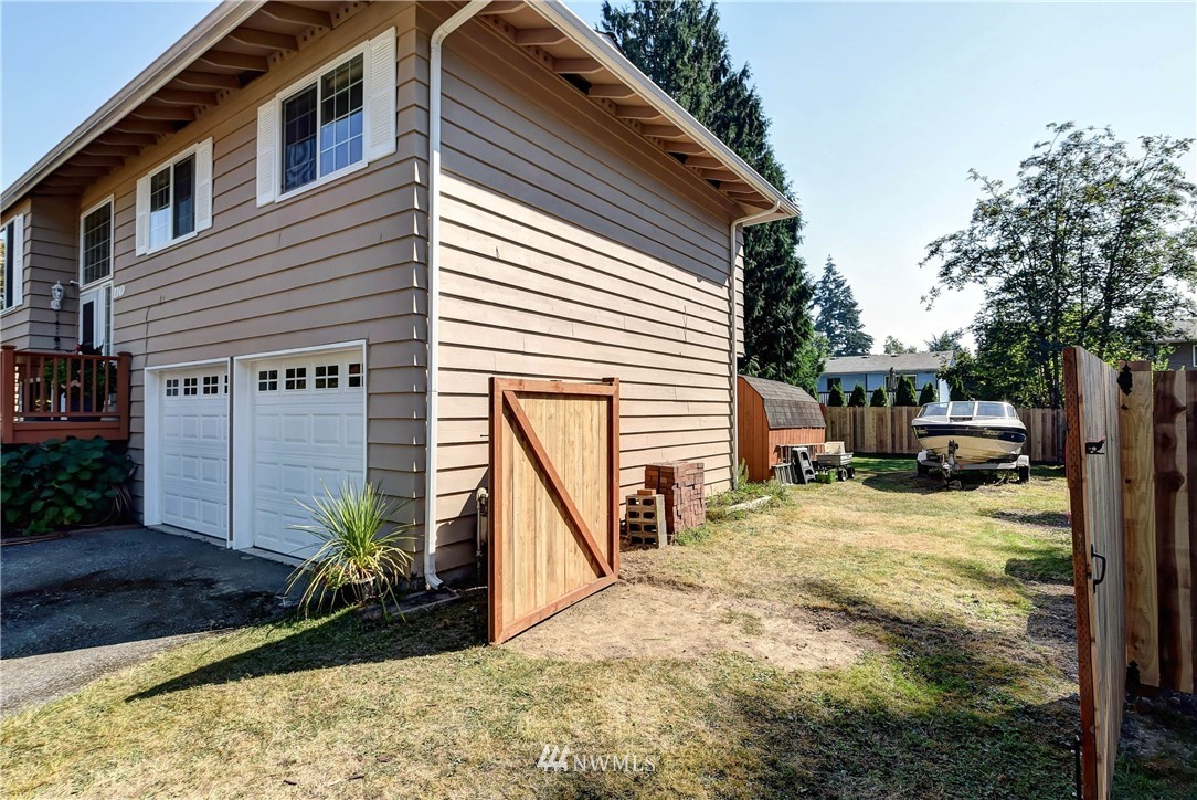 110 217th Place Southeast Bothell, WA 98021 - Photo 3 of 32 a view of a house with backyard and sitting area
