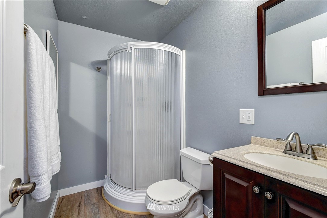 110 217th Place Southeast Bothell, WA 98021 - Photo 22 of 32 a bathroom with a granite countertop sink toilet and shower
