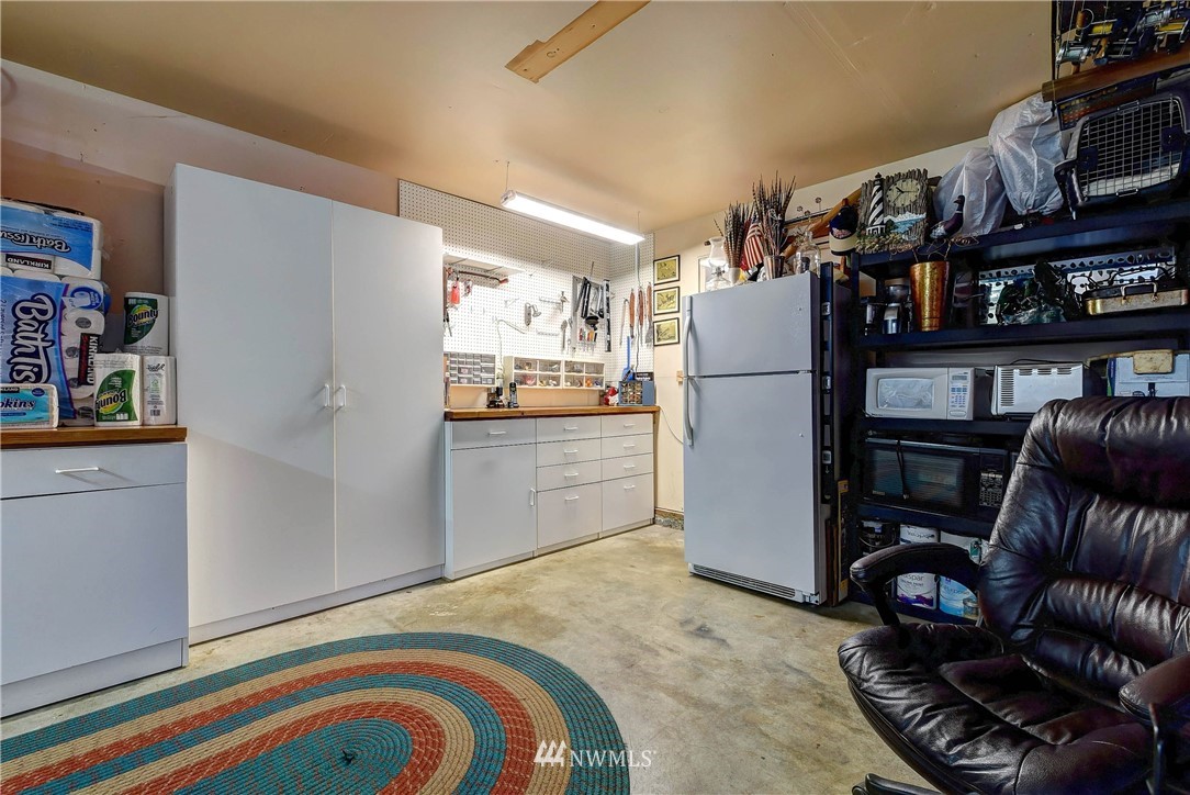 110 217th Place Southeast Bothell, WA 98021 - Photo 24 of 32 a kitchen with a refrigerator and a sink