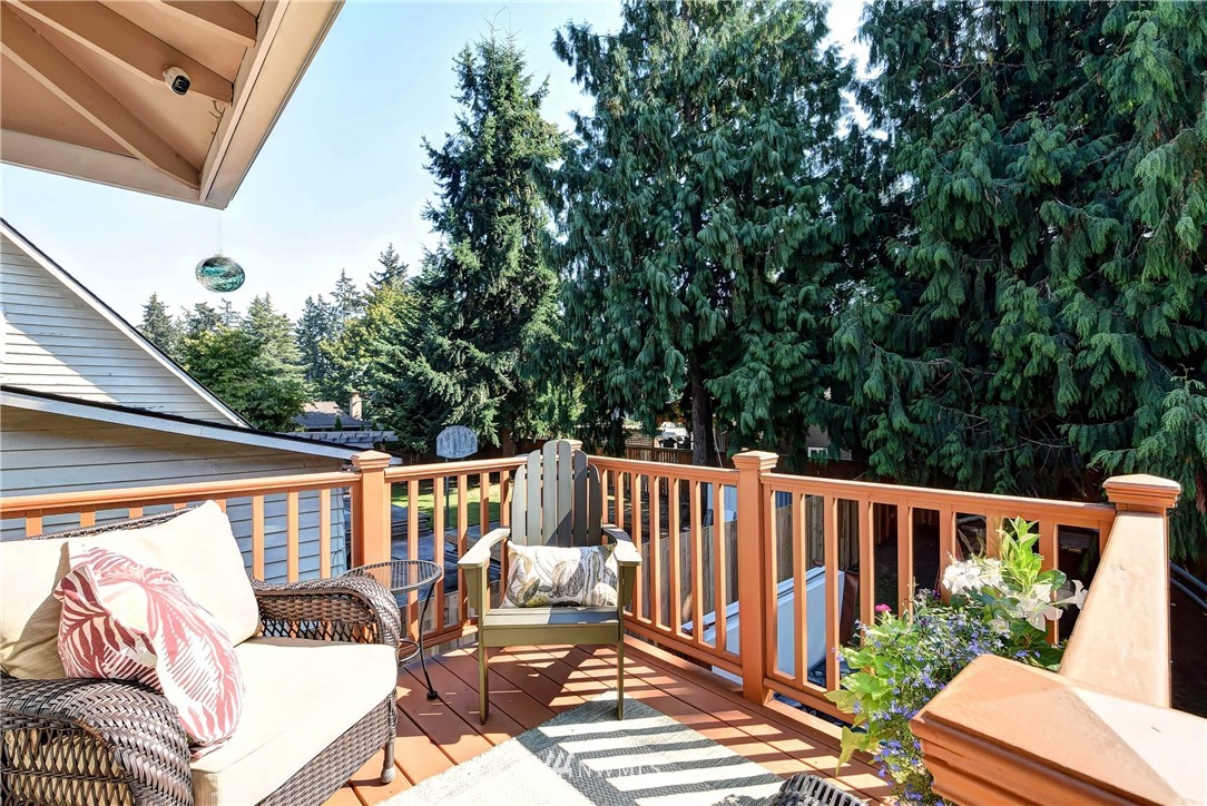 110 217th Place Southeast Bothell, WA 98021 - Photo 26 of 32 a view of balcony with wooden floor and outdoor seating