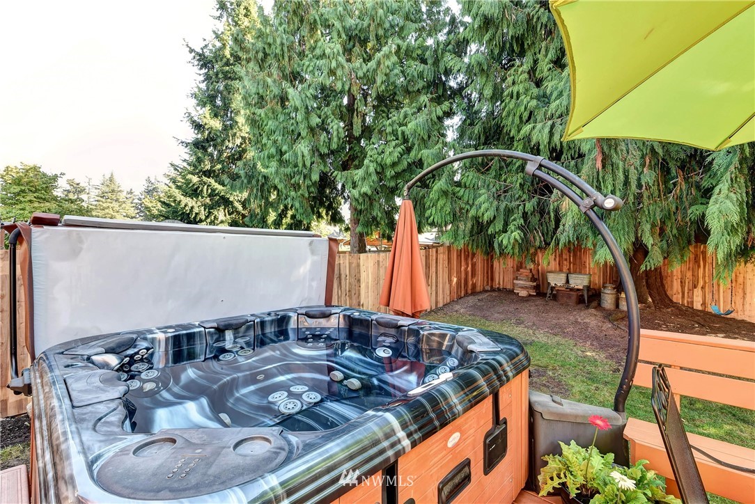110 217th Place Southeast Bothell, WA 98021 - Photo 28 of 32 a view of a backyard with plants and a patio