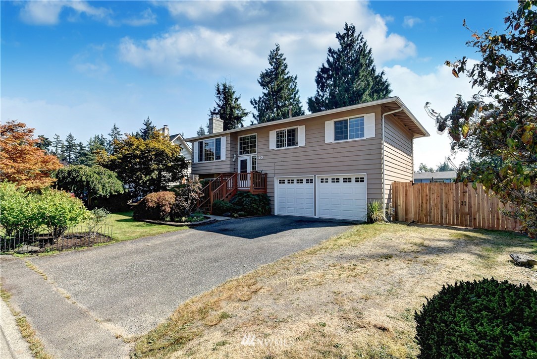 110 217th Place Southeast Bothell, WA 98021 - Photo 32 of 32 a front view of a house with a yard and garage