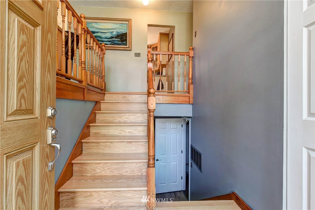 110 217th Place Southeast Bothell, WA 98021 - Photo 5 of 32 a view of entryway and hall with wooden floor