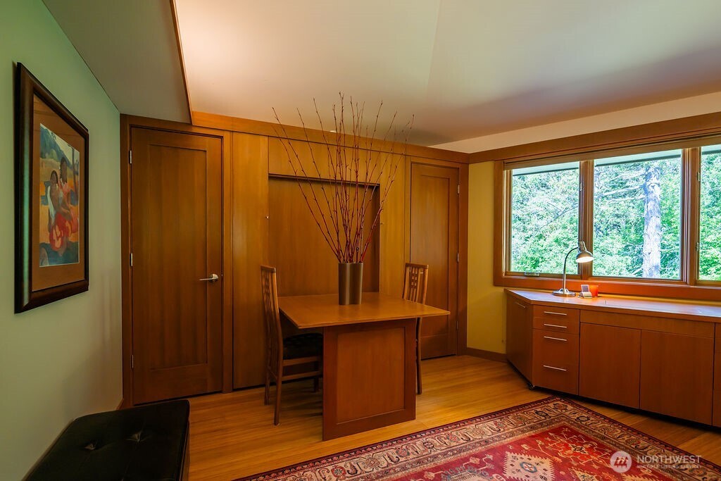 2000 Bayshore Road Lopez Island, WA 98261 - Photo 29 of 40 a room with wooden floor and furniture