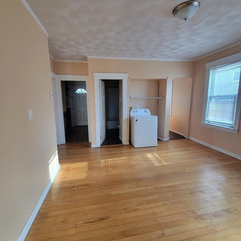 111 Rodney Street, Unit 2 Worcester, MA 01605 - Photo 3 of 9 wooden floor and window in a room