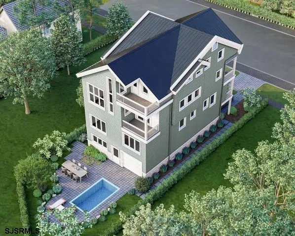 aerial view of a house with a yard