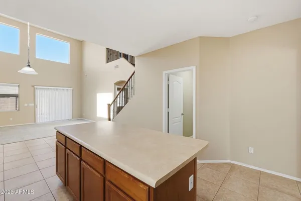 a kitchen with a stove a refrigerator and a sink