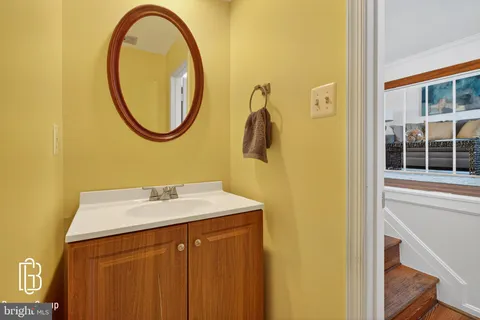 a bedroom with a bed wooden floor and window