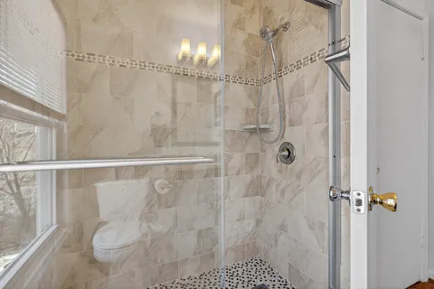 a view of a work space with furniture and a potted plant