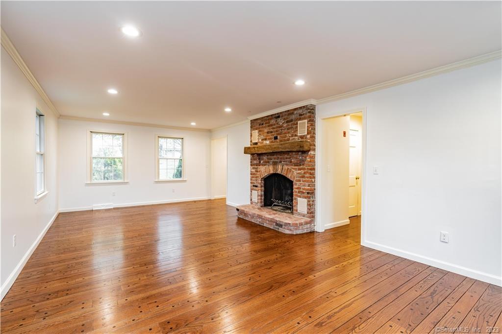 1241 Halladay Avenue West Suffield, CT 06078 - Photo 14 of 29 a view of empty room with wooden floor and fireplace
