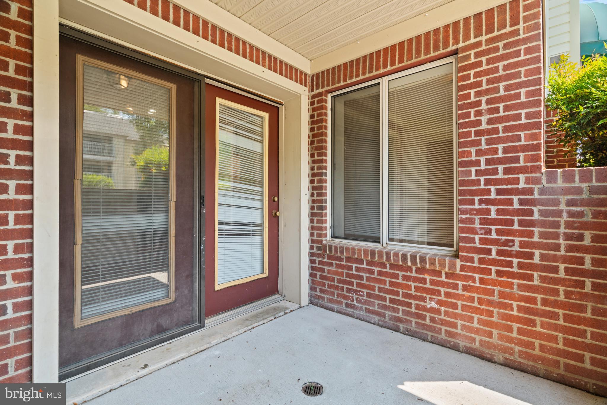 2106 Whitehall Road, Unit BA Frederick, MD 21702 - Photo 3 of 12 Interior leads out to private, brick-walled patio