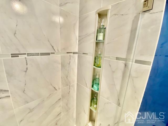 8 Woodpecker Road Howell, NJ 07731 - Photo 14 of 32 a bathroom with a shower