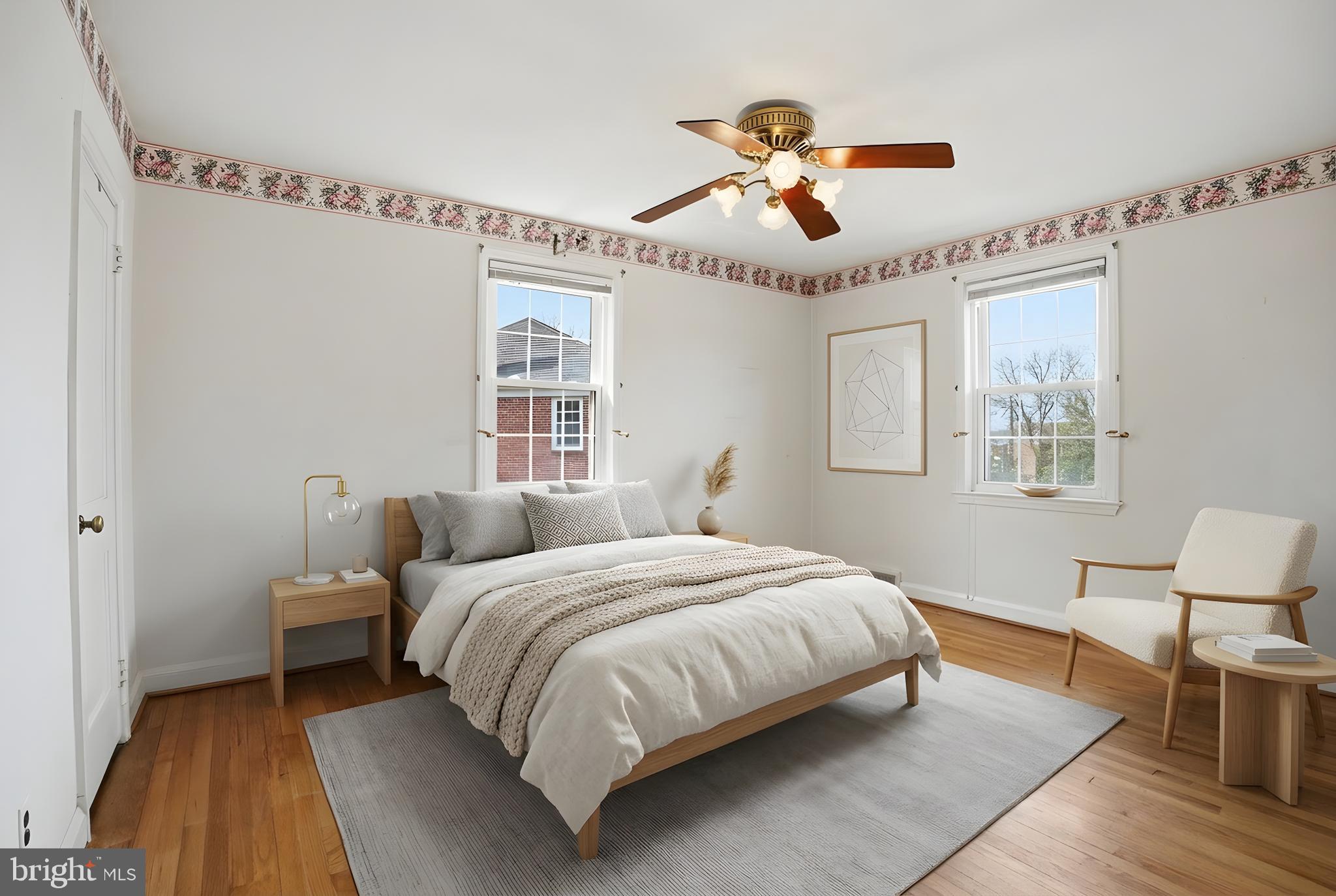 123 Glen Argyle Road Baltimore, MD 21212 - Photo 14 of 33 a bedroom with a bed chandelier and a window