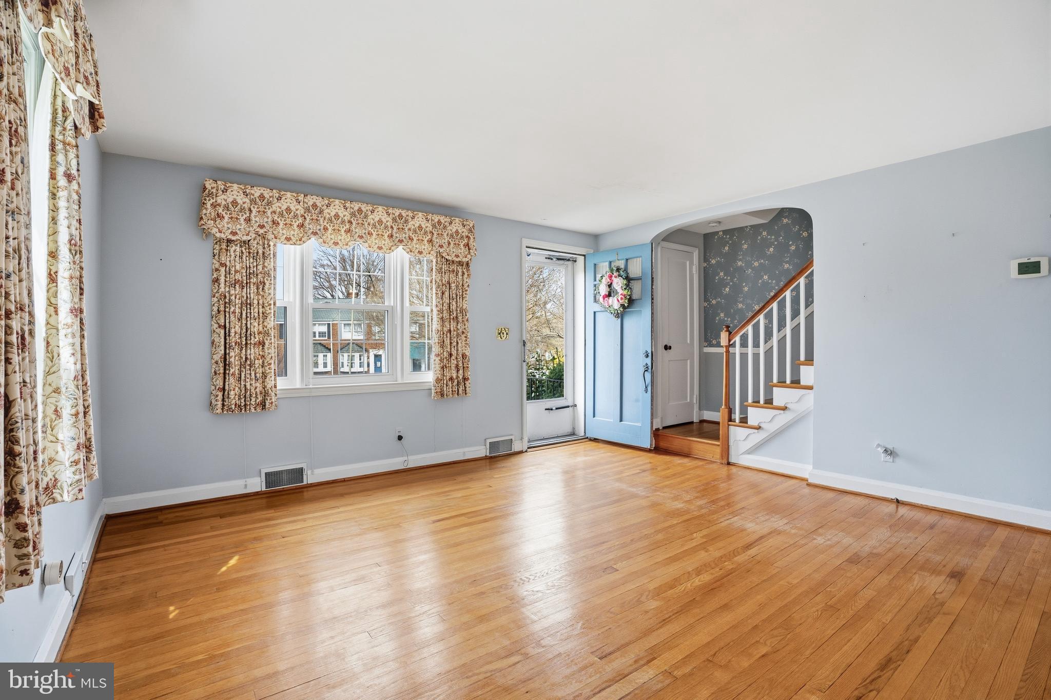 123 Glen Argyle Road Baltimore, MD 21212 - Photo 3 of 33 a view of an empty room with wooden floor and a window