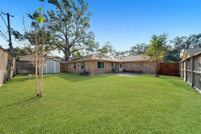 a view of houses with outdoor space and garden