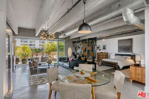a living room with lots of furniture and a flat screen tv