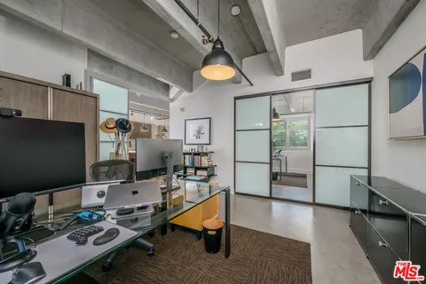 a workspace with furniture and wooden floor