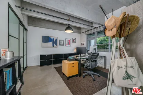 a bedroom with furniture and a window