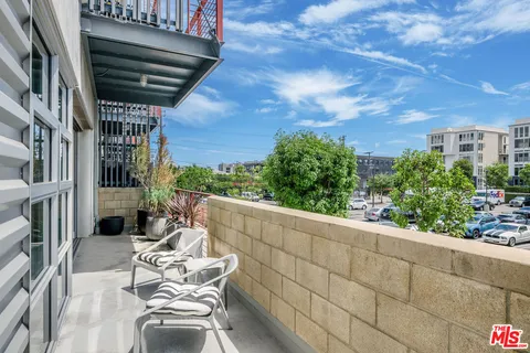 a view of balcony with furniture
