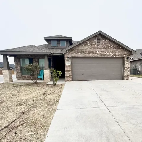 a front view of a house with yard