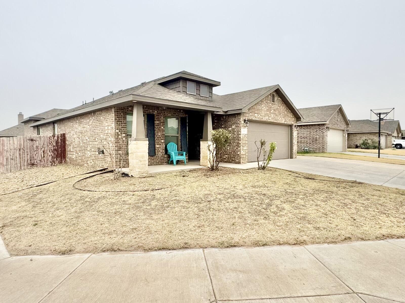 13801 Avenue West Lubbock, TX 79423 - Photo 2 of 17 a view of a house with snow on the wall