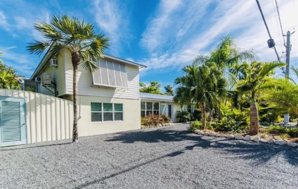 2635 Koehns Avenue Big Pine Key, FL 33043 - Photo 1 of 13 a front view of a house with a yard and garage