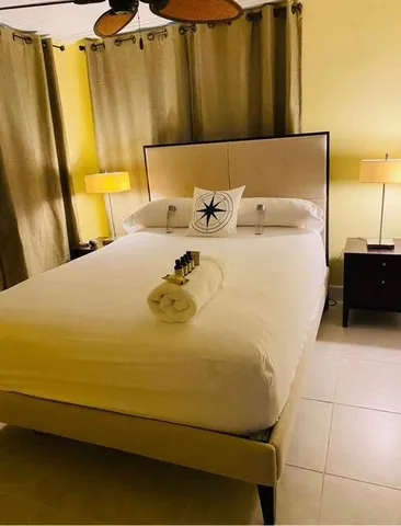 a bed sitting in a bathroom next to a blue wall