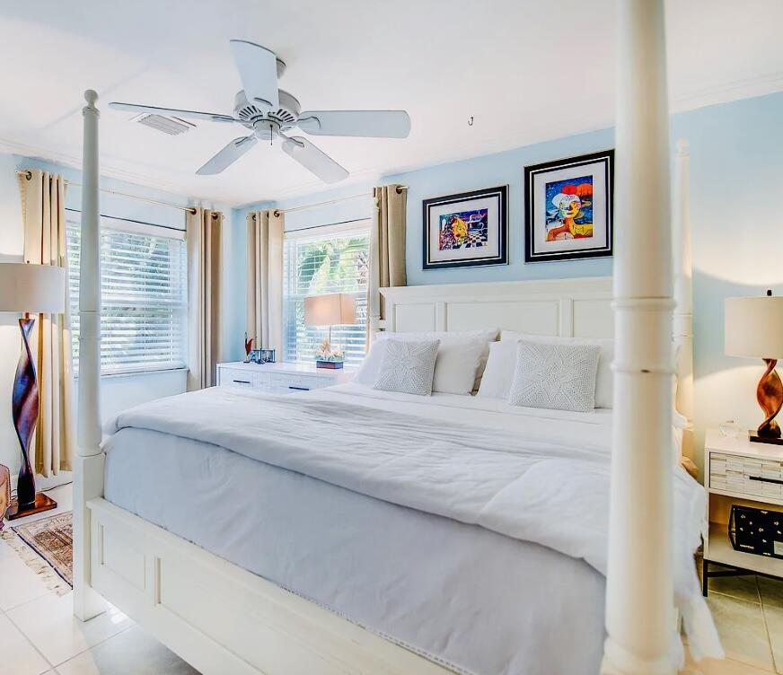 2635 Koehns Avenue Big Pine Key, FL 33043 - Photo 4 of 13 a bedroom with a bed and a chandelier