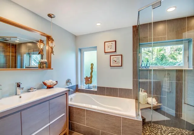 a bathroom with a tub sink and toilet
