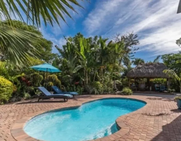 a view of a swimming pool with an outdoor space and seating area