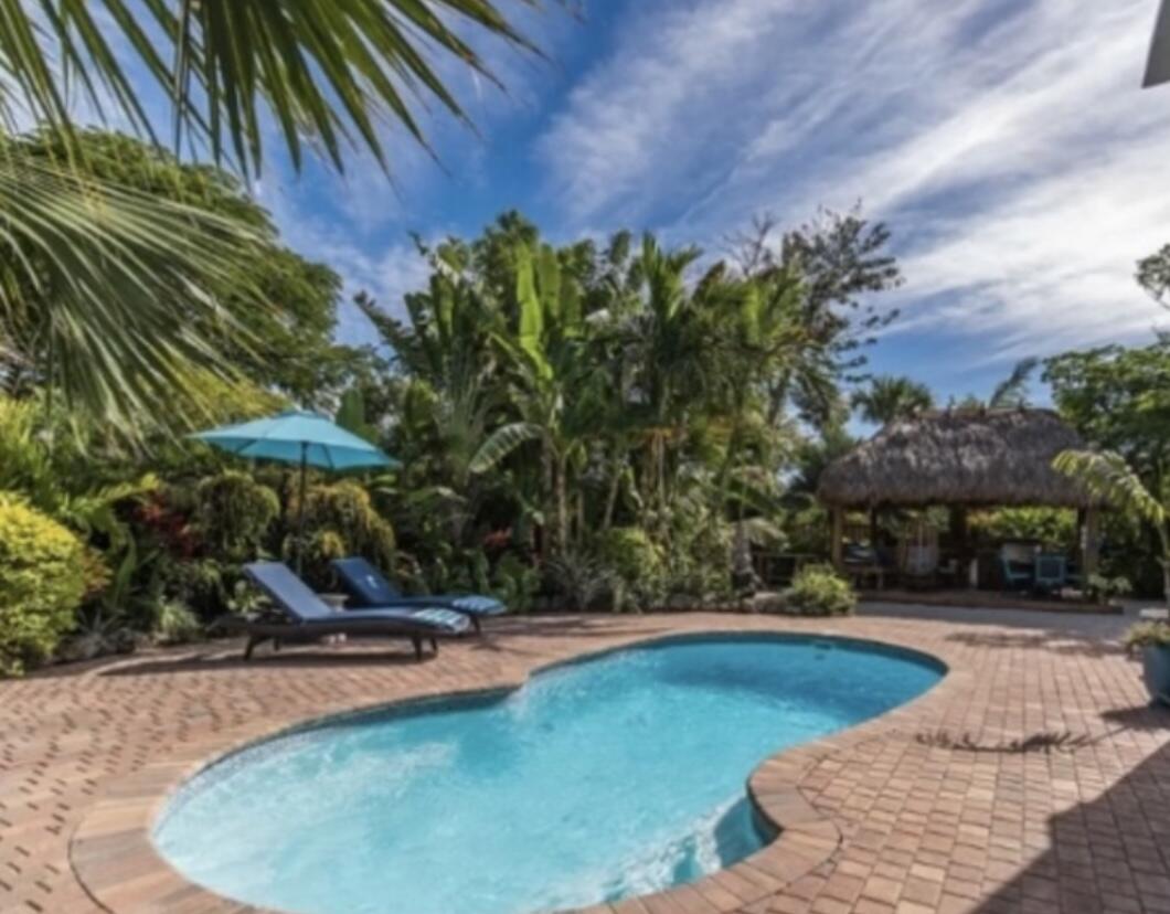 2635 Koehns Avenue Big Pine Key, FL 33043 - Photo 8 of 13 a view of a swimming pool with an outdoor space and seating area